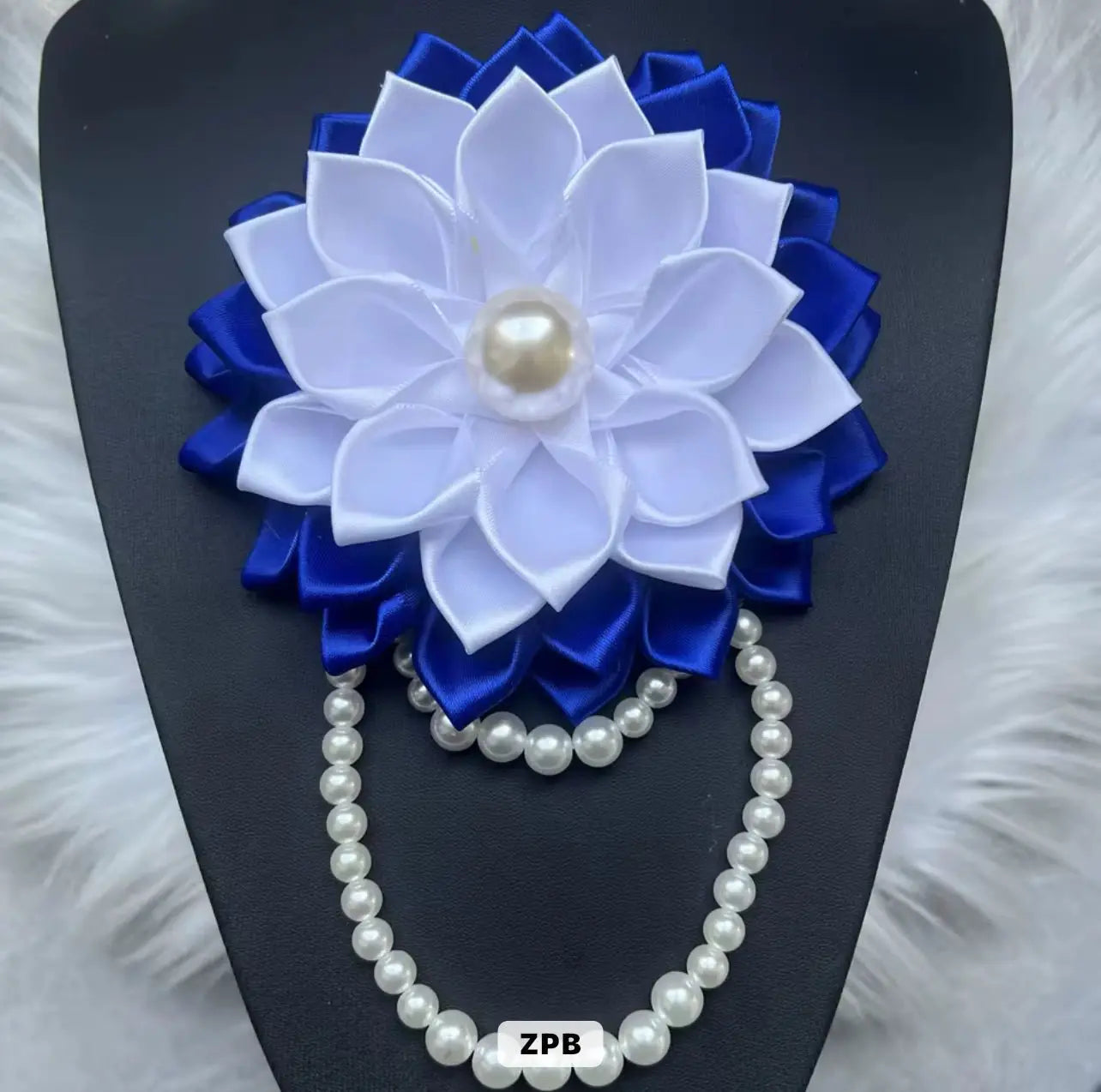 Elegant ZPB brooch with pearls, blue ribbon & floral accents — for sorority events, meetings & thoughtful sisterhood gifts.