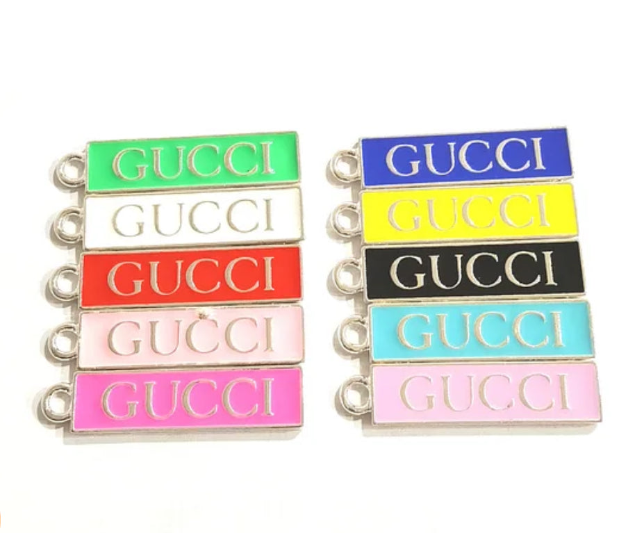 Silver GUCCI TAG CHARM – Designer-inspired alloy charm for customizing bracelets, keychains, shoes, and more. Add a touch of luxury to your personalized fashion creations.