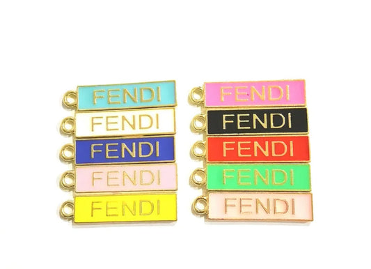 GOLD FENDI TAG CHARM – Colorful, designer-inspired alloy charm perfect for customizing accessories like shoes, bags, keychains, and jewelry. Add luxury vibes and bold flair to your creations.