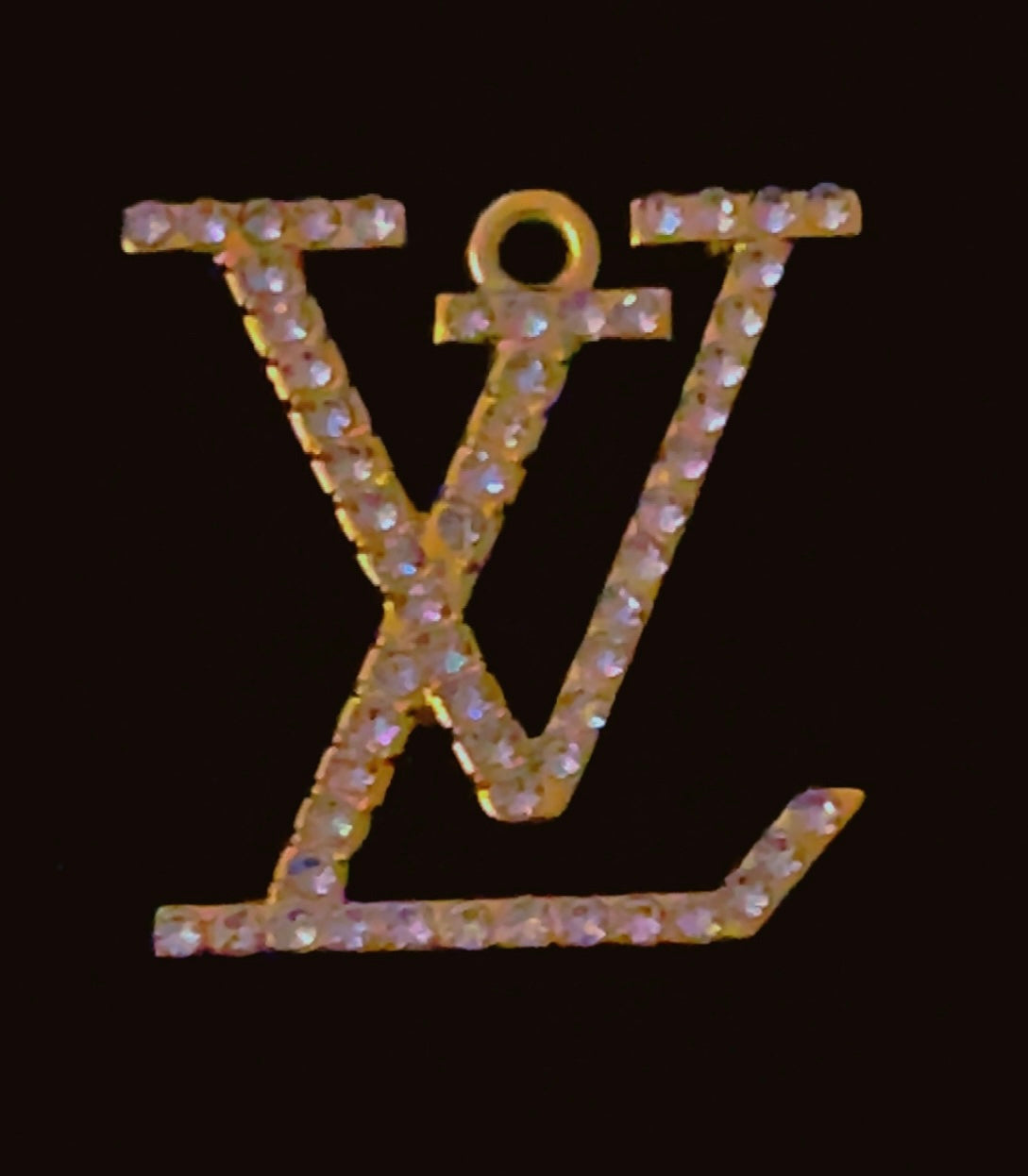 Luxury LV-inspired charm featuring a premium gold finish and sparkling rhinestone accents, perfect for customizing Crocs, bags, and accessories; ideal for fashion enthusiasts seeking elegant designer-inspired embellishments.