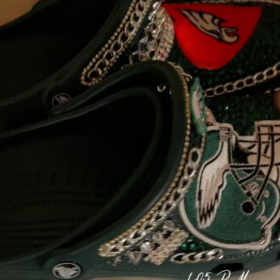 Philadelphia Eagles Custom Crocs featuring team logo, rhinestones, and chains for a stylish fan accessory.