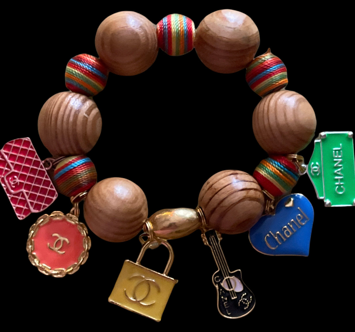 MARLEY: Medium Brown Wooden Beads with Chanel-Inspired Charms & Rainbow Beaded Bracelet – Elevate Your Style! - A chic and stylish bracelet with medium brown wooden beads, Chanel-inspired charms, and vibrant rainbow beads."